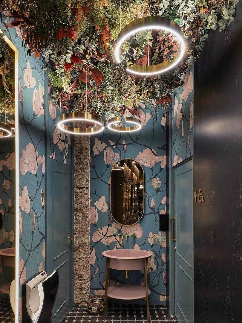Ring pendants beneath a floral ceiling display