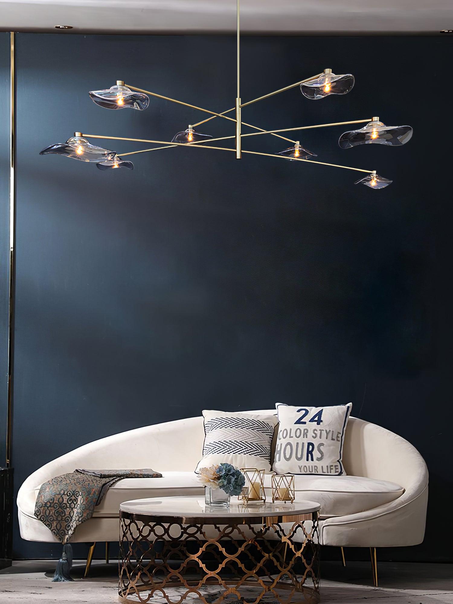 Gold glass chandelier above lounge seating