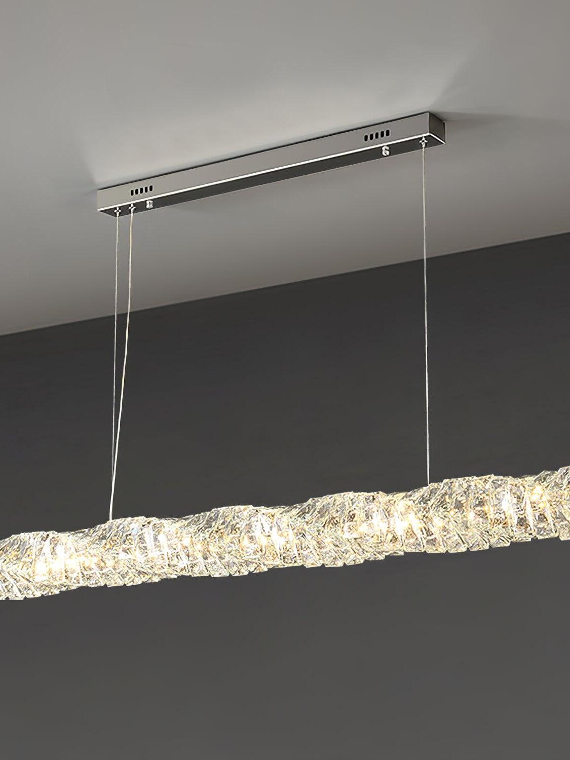 Angled view of the chrome canopy and long crystal bar with warm-looking light