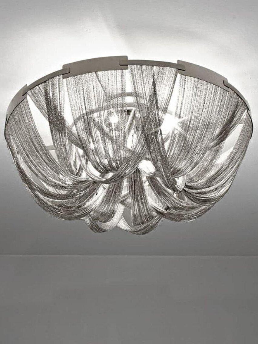 Silver chain drape ceiling light illuminated against white