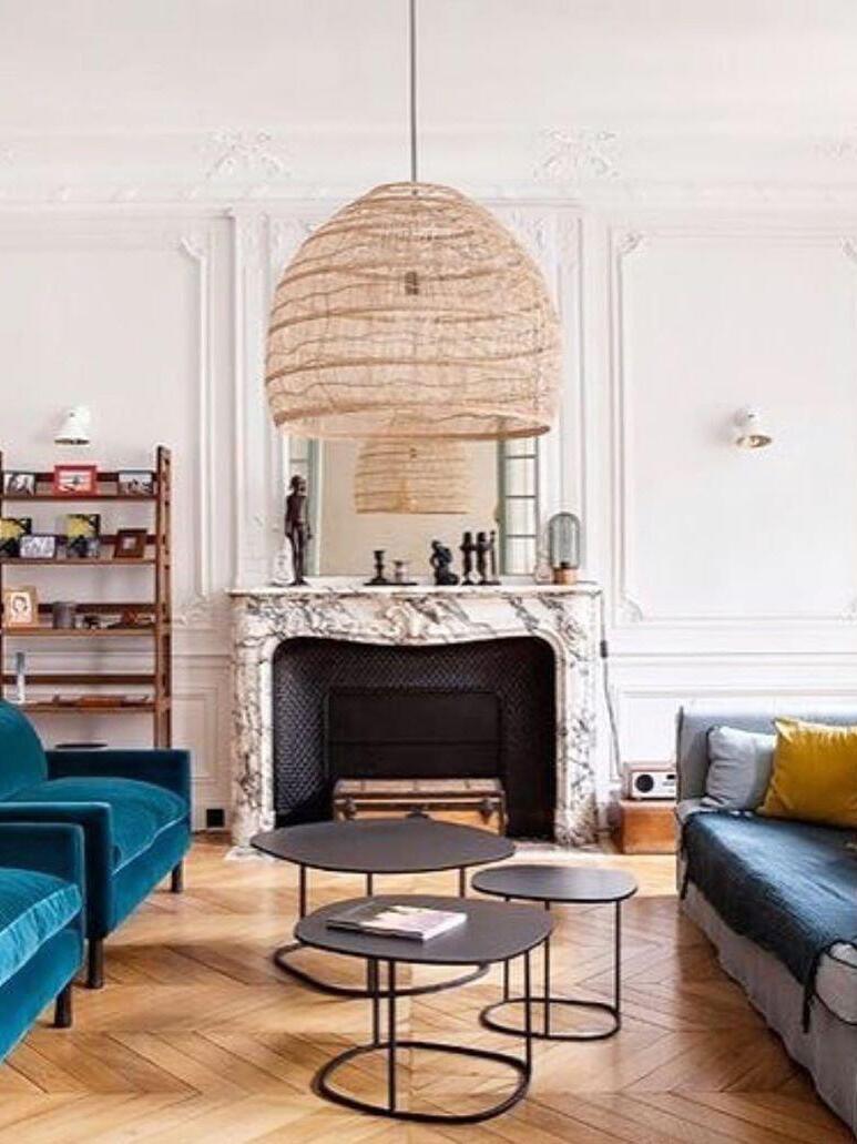 Natural wicker light in a room with a fireplace
