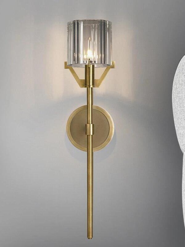 Tall Gold stem below the clear cylindrical shade