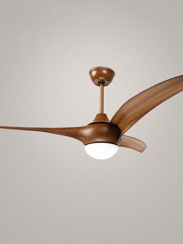 Brown three-blade fan with woodgrain appearance, illuminated round diffuser and matching canopy and rod against gray