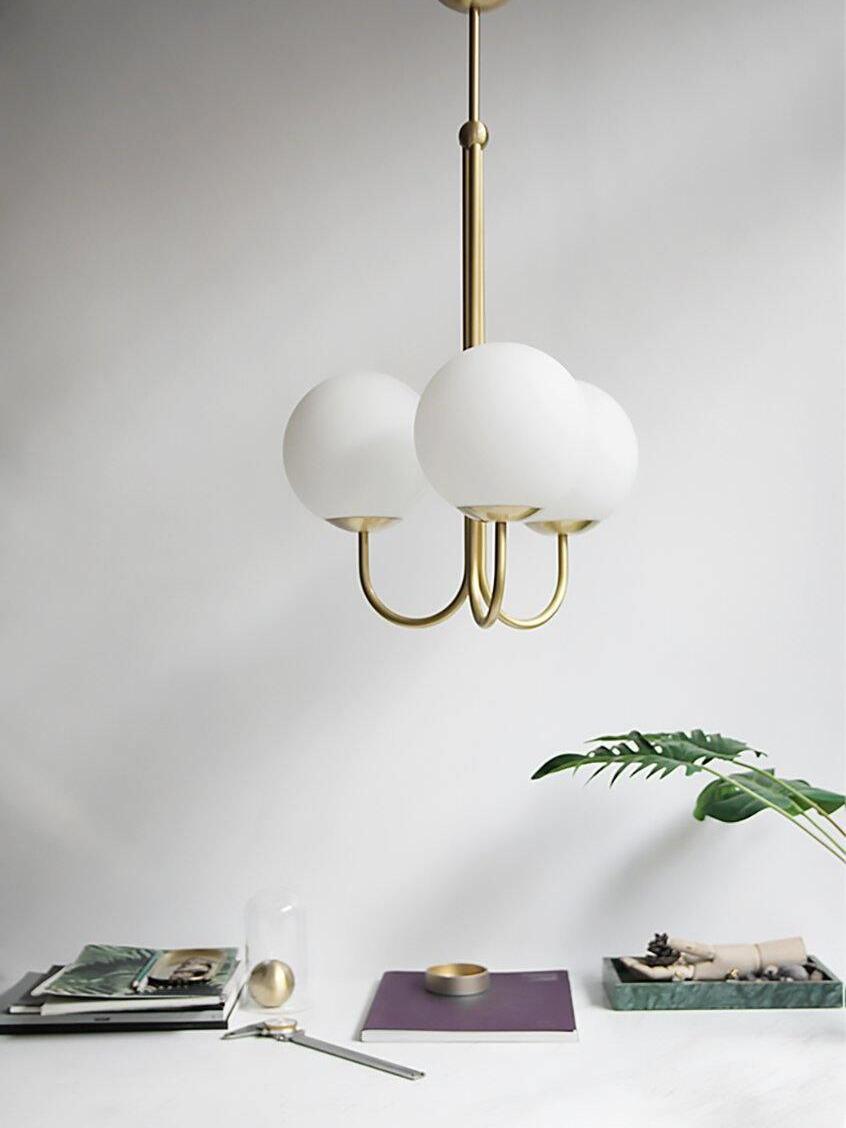 Angle pendant above an indoor table setting