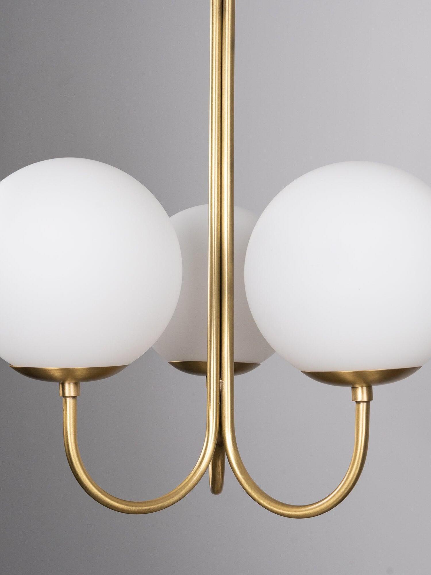 U-curved arms beneath three Opal globes close-up