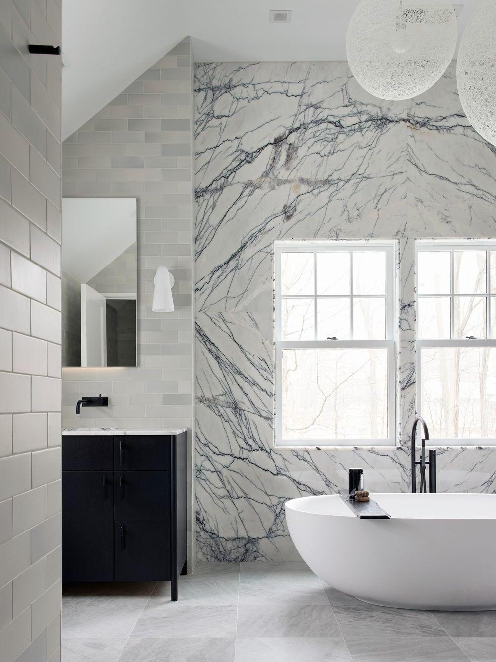 Wall fixture in a marble-patterned bathroom setting
