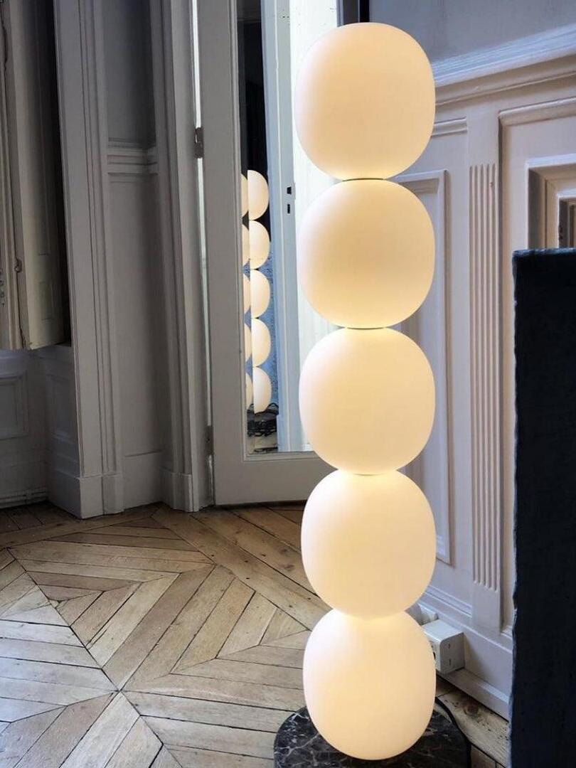 Glowing globe column near a doorway
