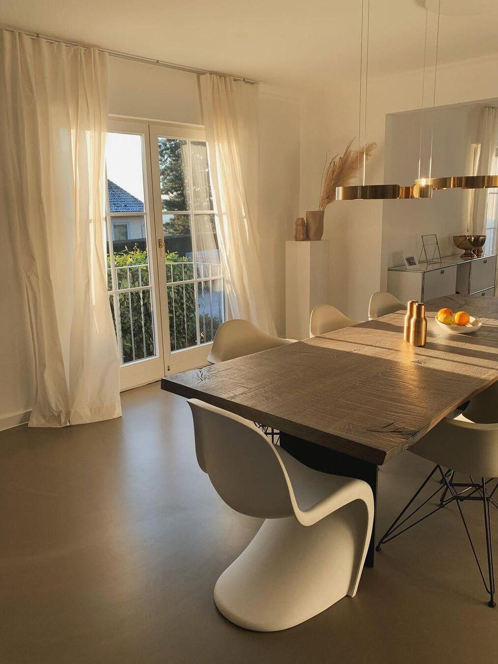 Ring lighting near a dining table and window