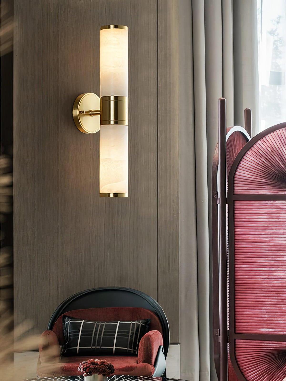 Tall two-ended wall lamp beside chair and screen