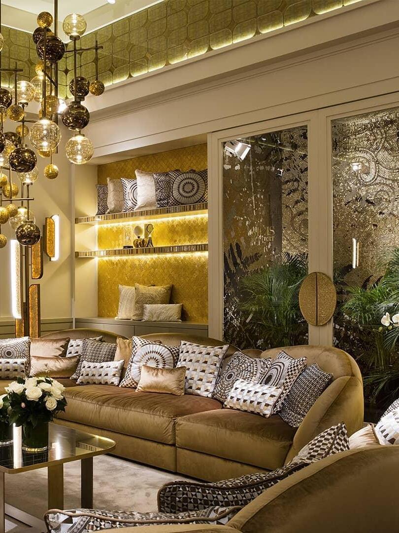 Several glass pendants above a warm-toned sofa