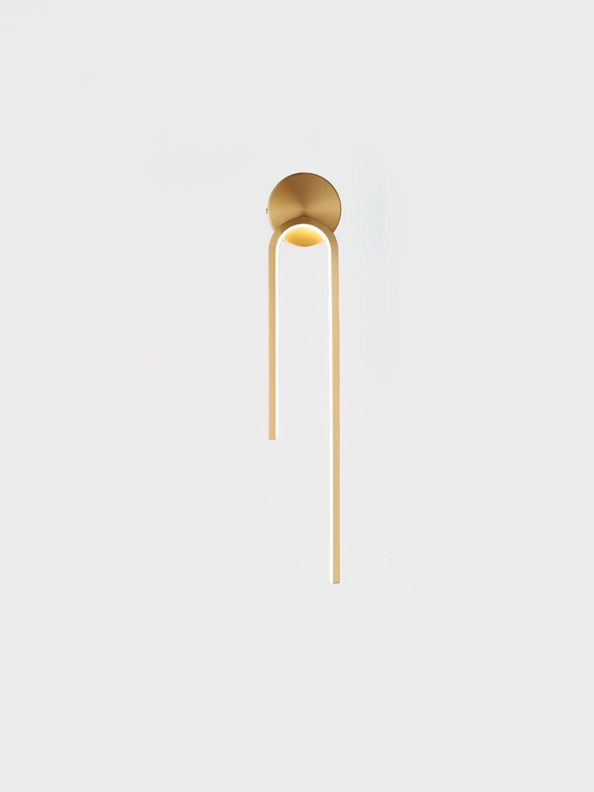 Gold-tone arch with a long right arm and short left arm beneath a round mount on a pale background