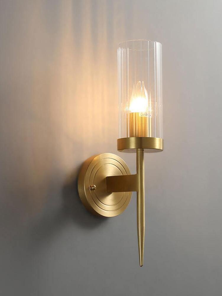 Single ribbed-glass cylinder casting a warm wall glow