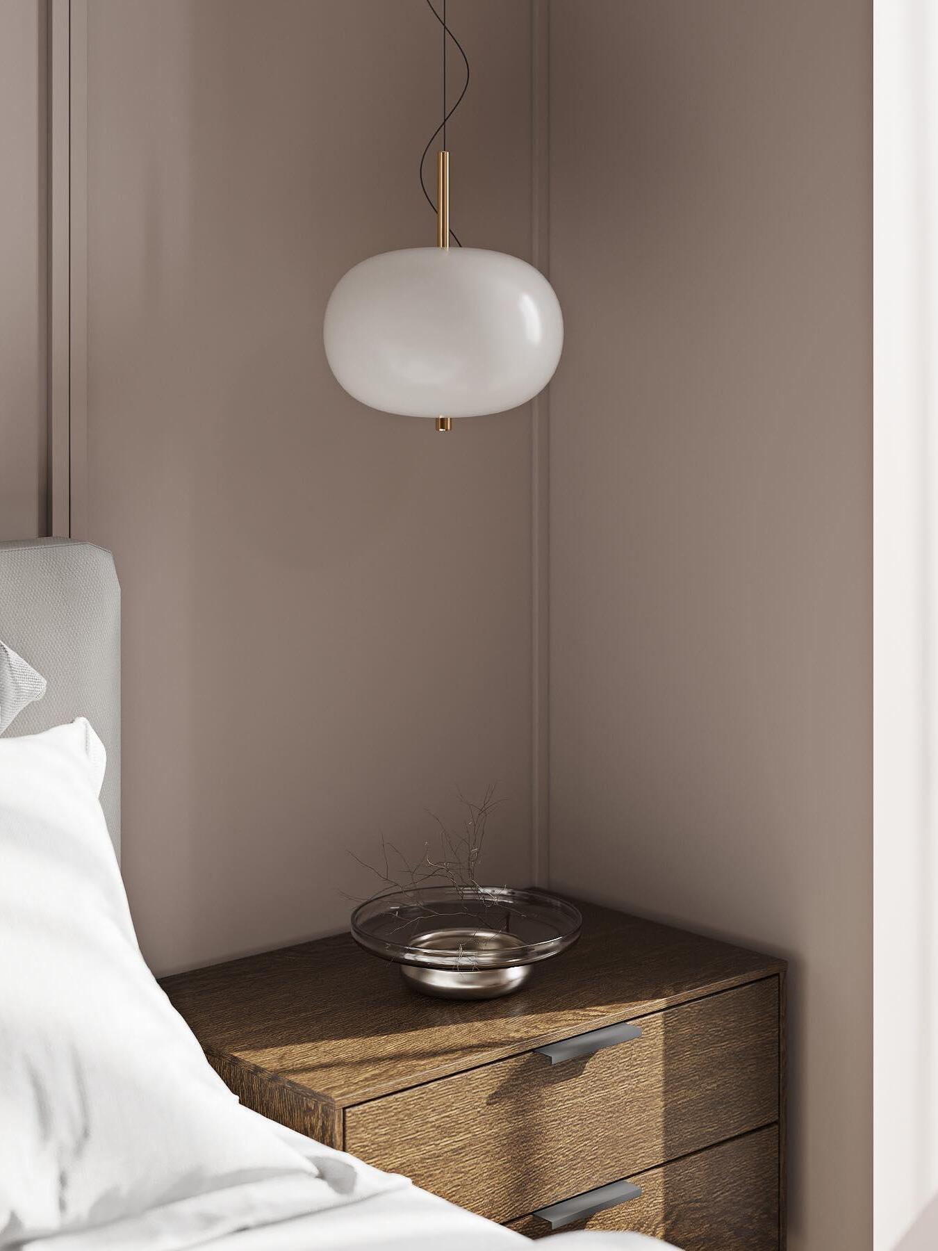 White globe beside a bedside table