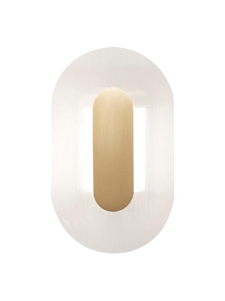 Isolated elongated Button wall light with clear ribbed glass and a gold-coloured pill-shaped centre