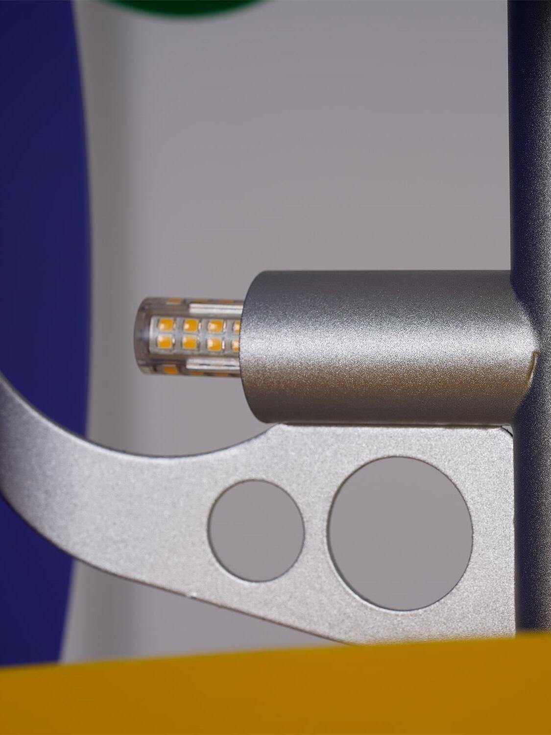 Close-up of bulb beside panel support bracket