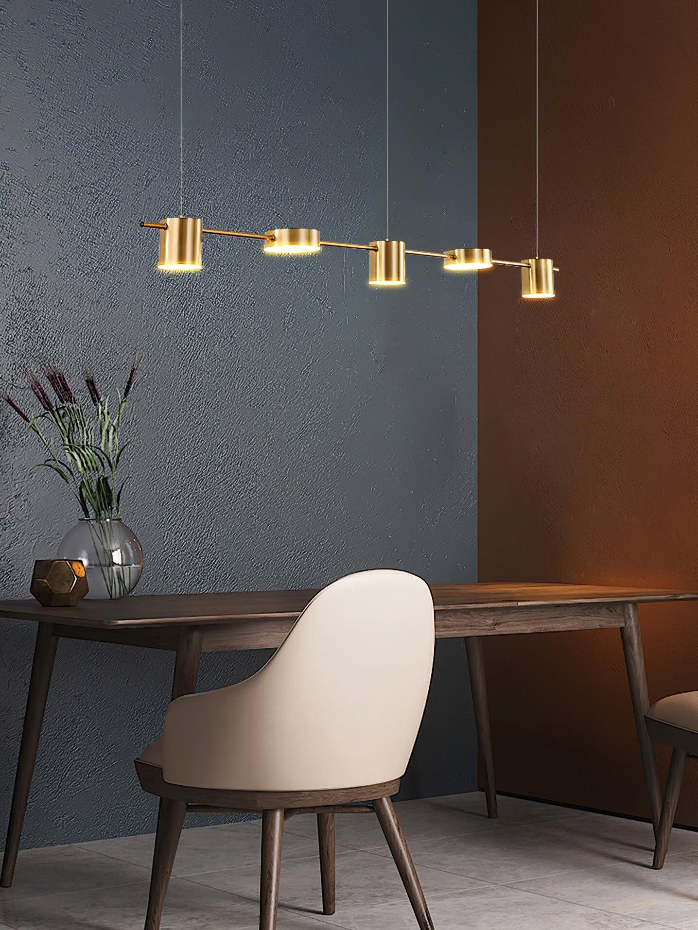 Short gold fixture above a desk and pale chair