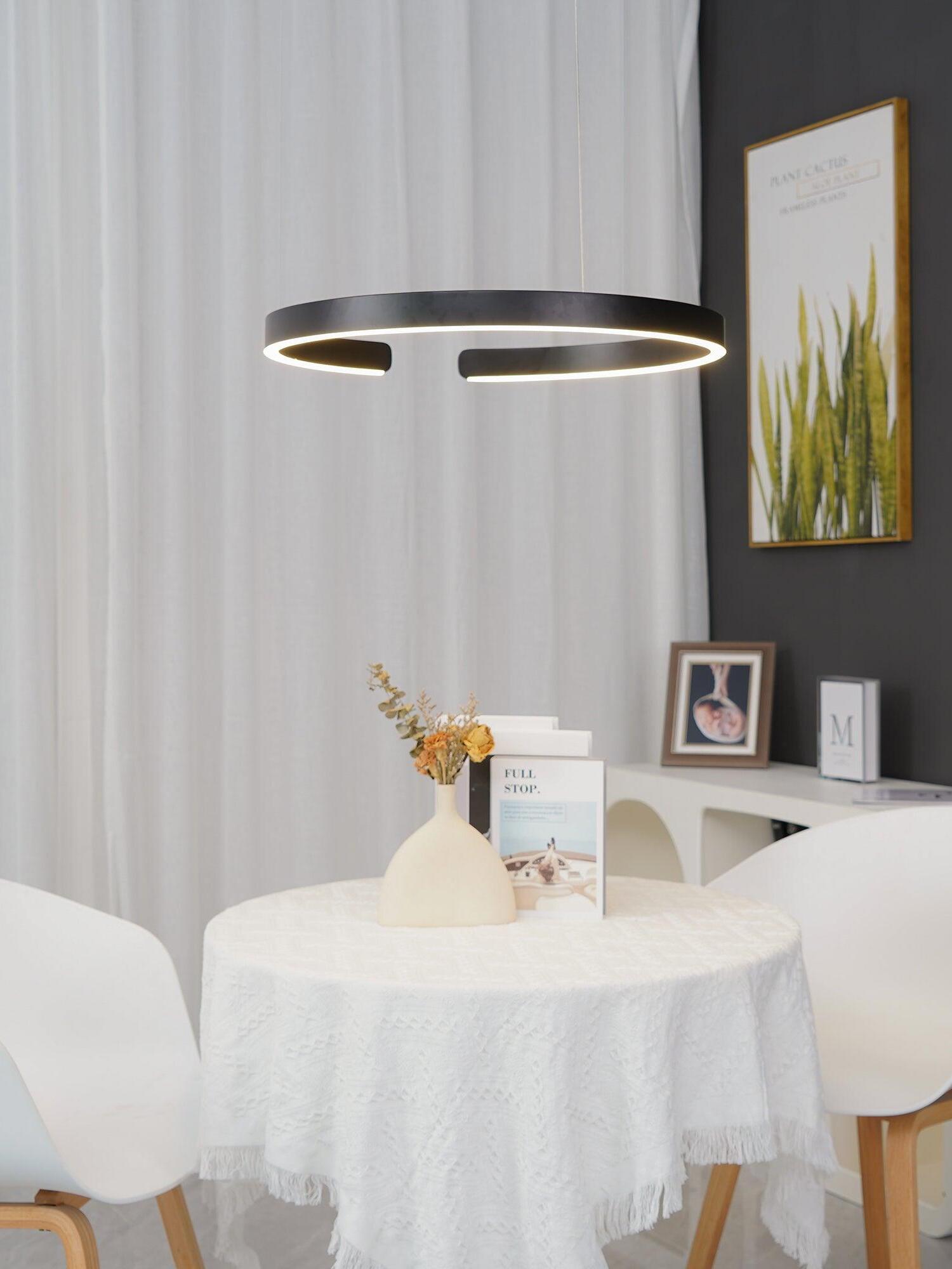 Illuminated black ring near curtains