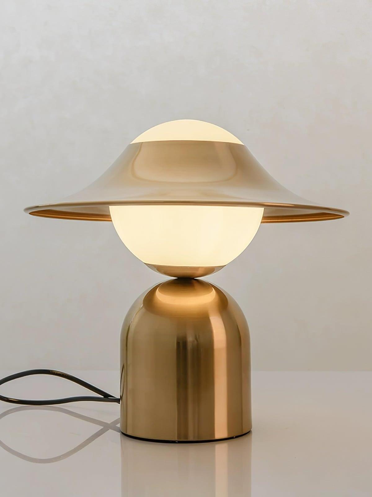 Front view of glowing globe with gold disc and base