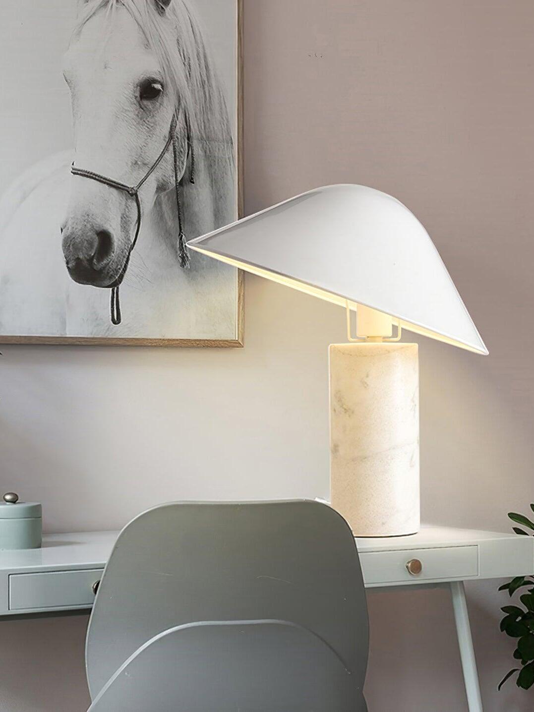 White Adelaide lamp on desk below wall art