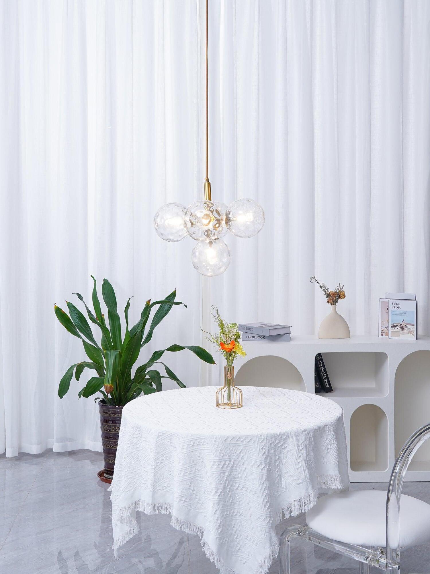 Clear cluster pendant in a bright dining corner