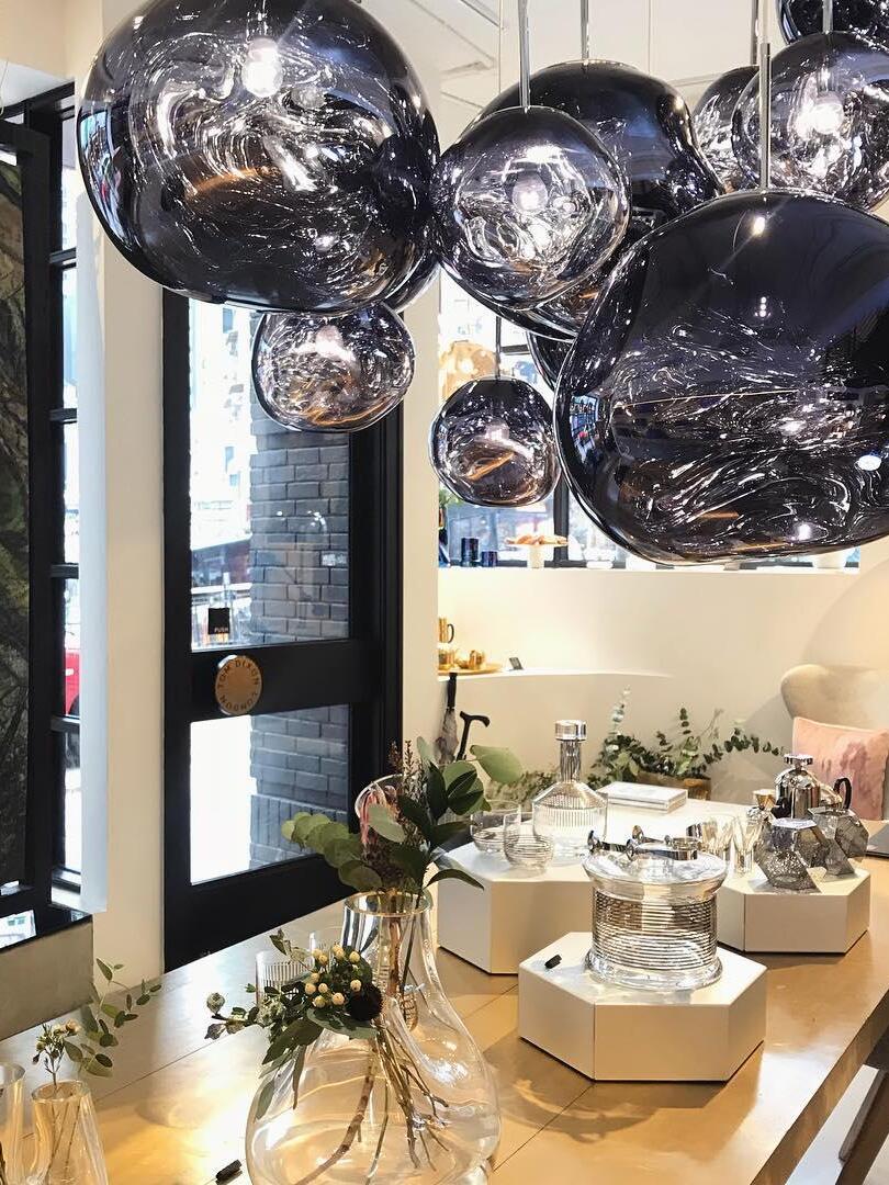 Reflective shades above a bright dining setting