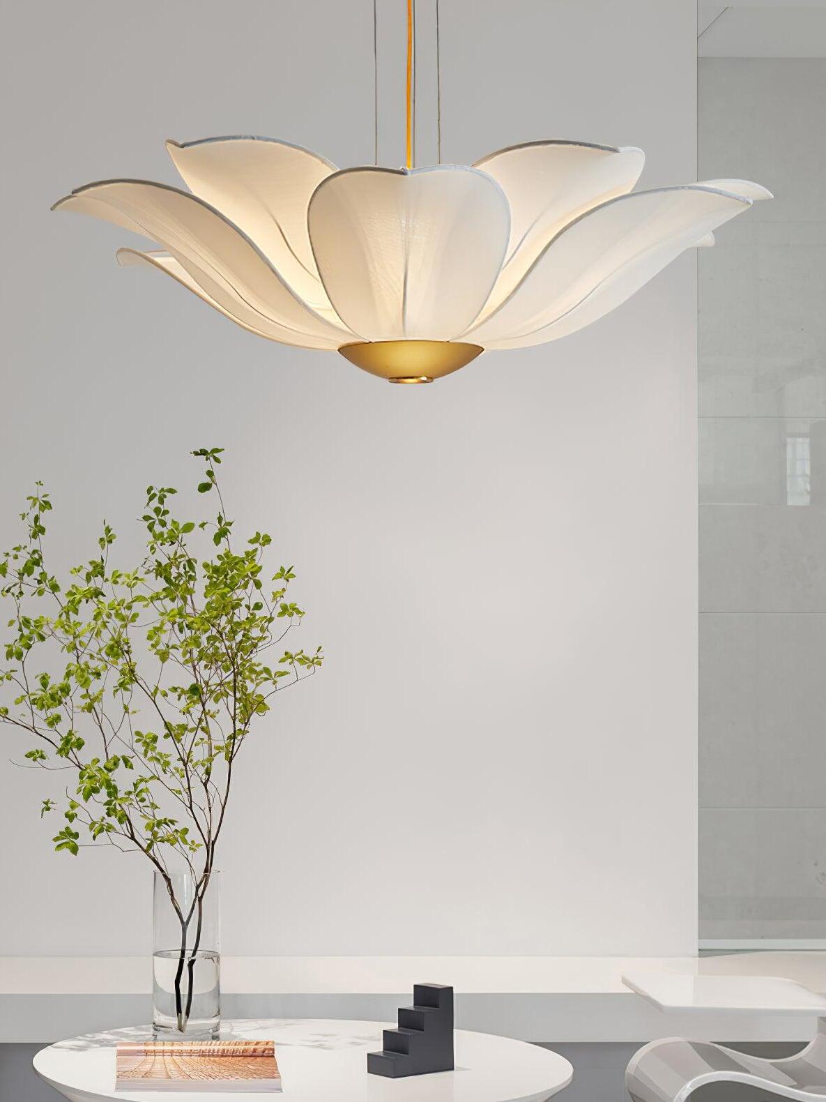 Gold and white petal chandelier above round table