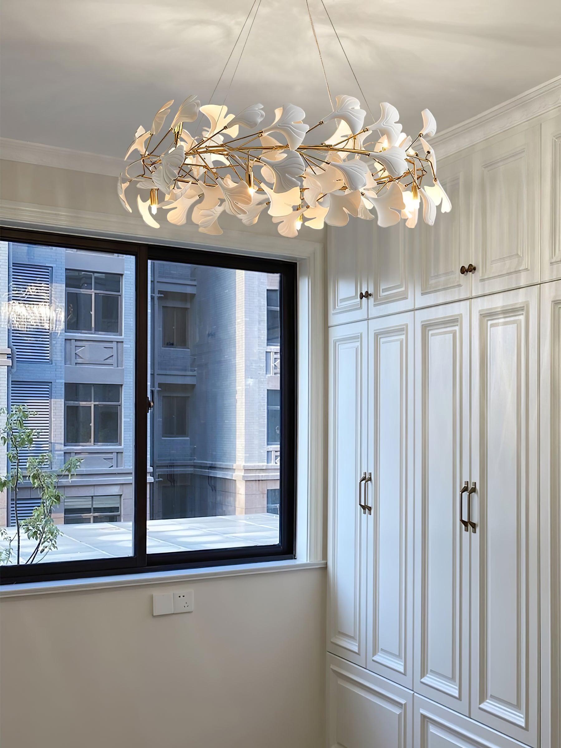 Gingko O suspended leaf ring beside a window