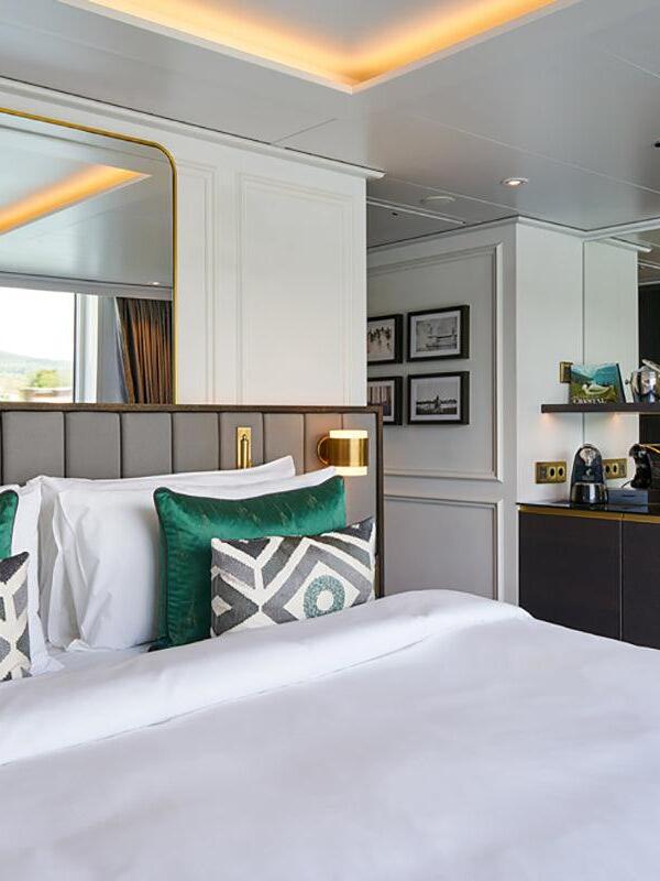 Recessed bedside lights in a bright bedroom