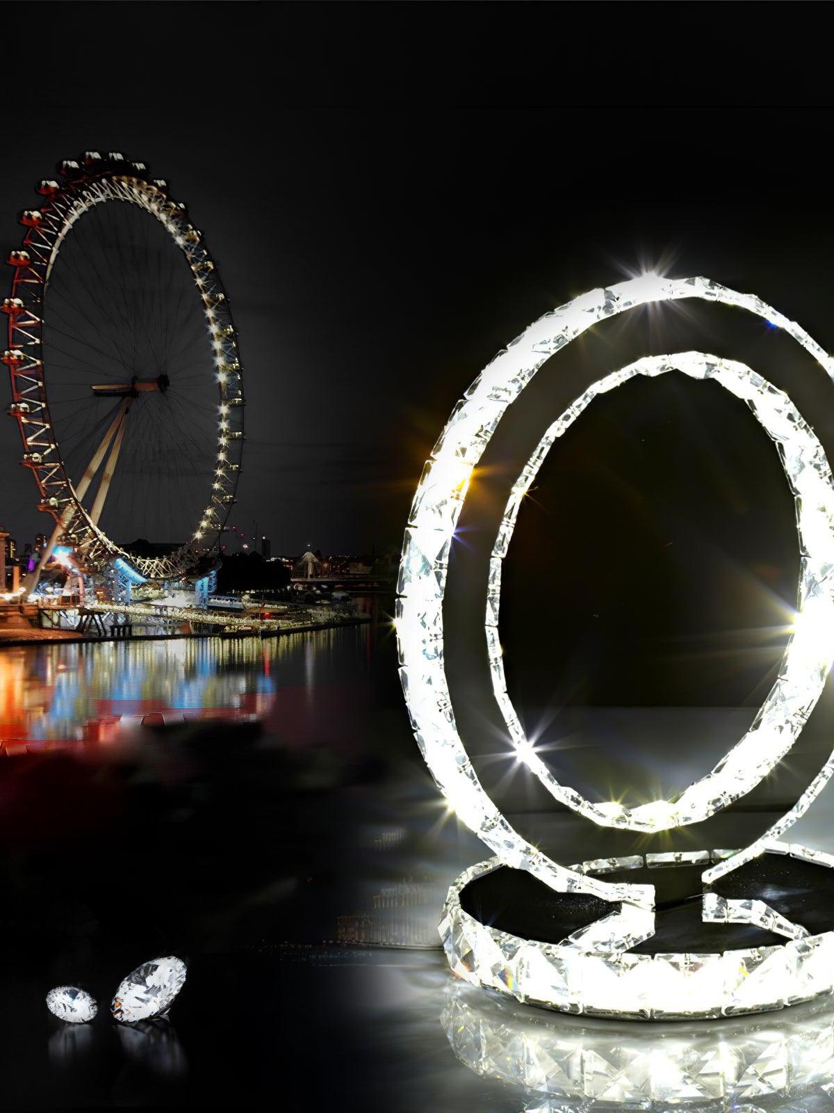 Bright ring lamp near a decorative wheel, with small faceted objects in the foreground
