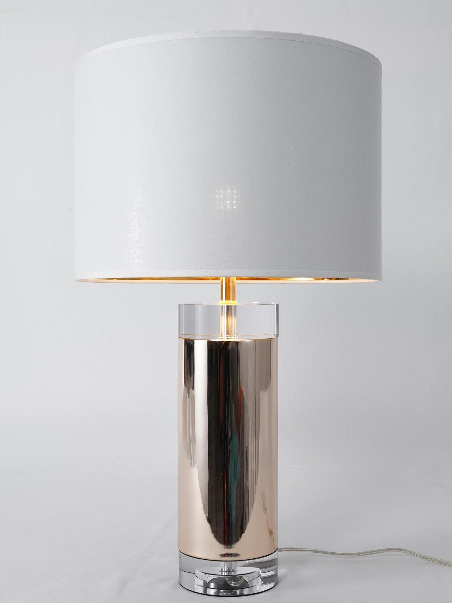 Isolated white-shade reflective cylinder lamp with clear base and translucent cord