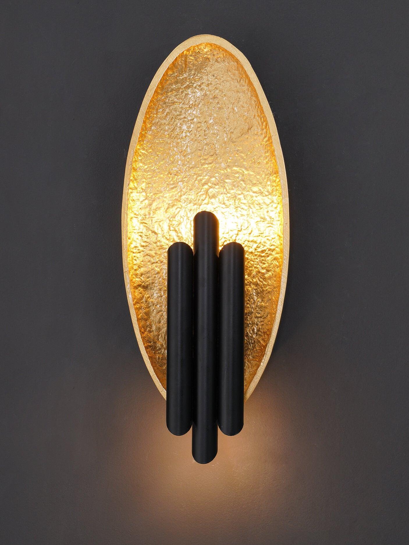Front lit gold-tone oval panel with dark staggered tubes