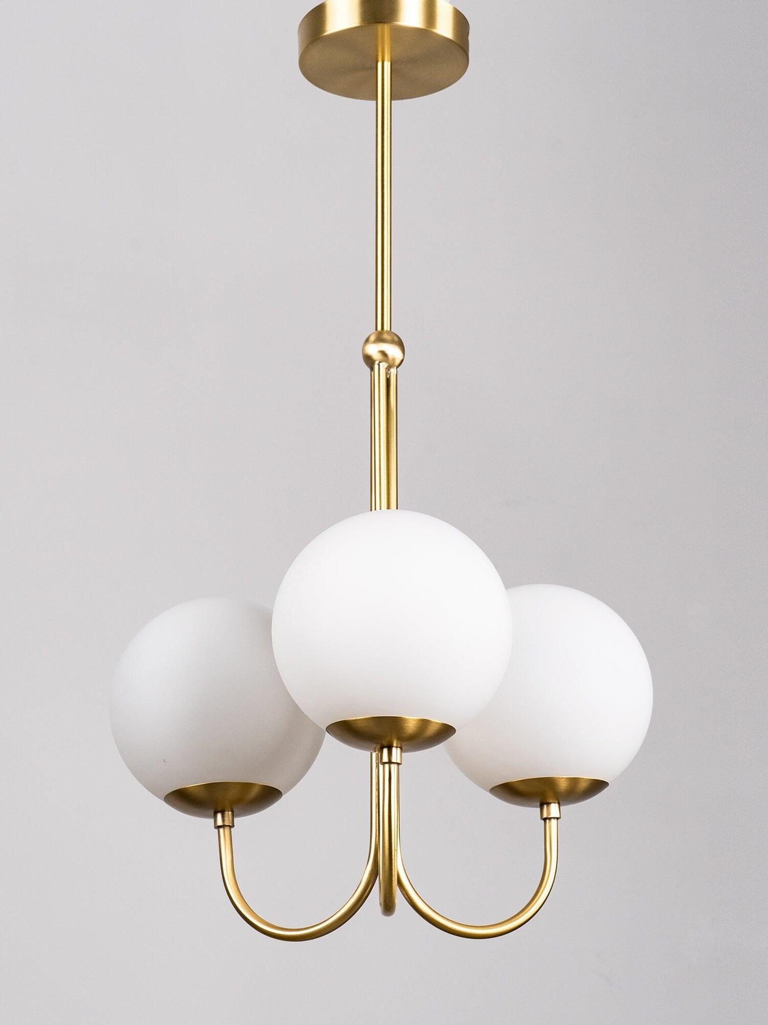 Three-globe pendant suspended from round canopy