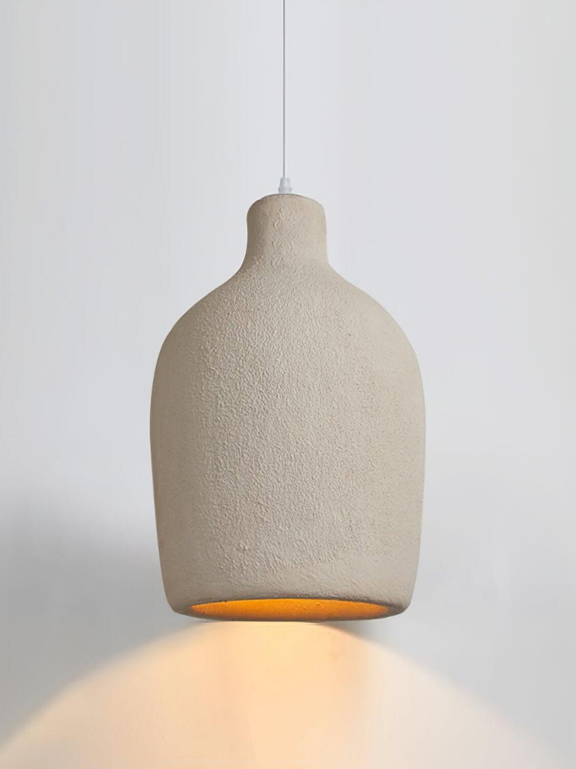 Lit broad bottle-form shade with rounded shoulders, textured surface and warm light below
