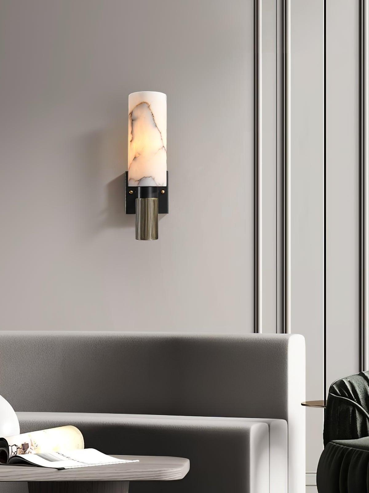 White marble wall light above a seating area
