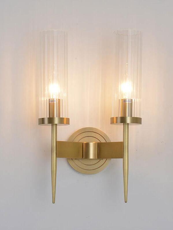 Two glowing glass cylinders above tapered stems