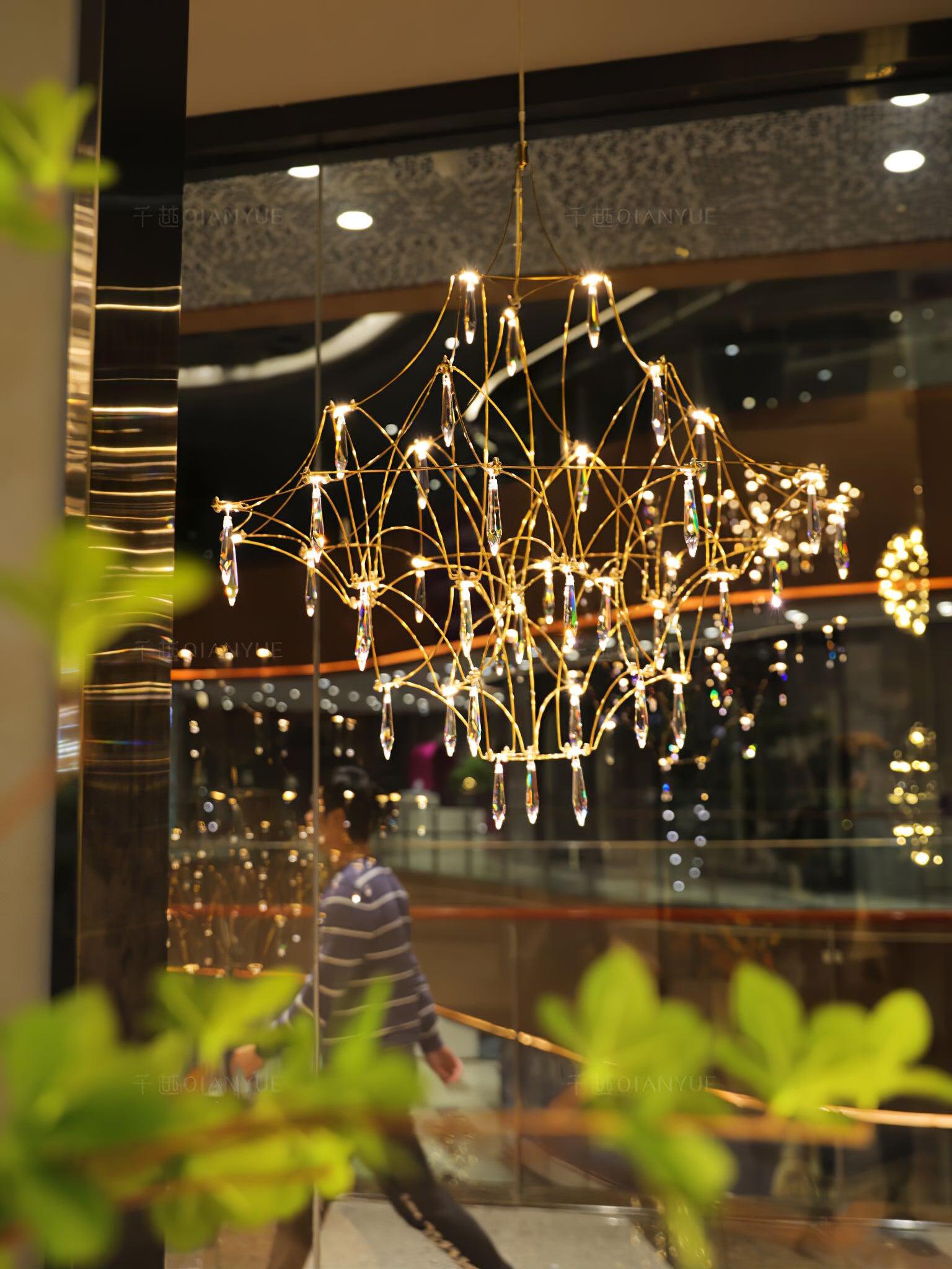 Illuminated Gold lattice chandelier in a display