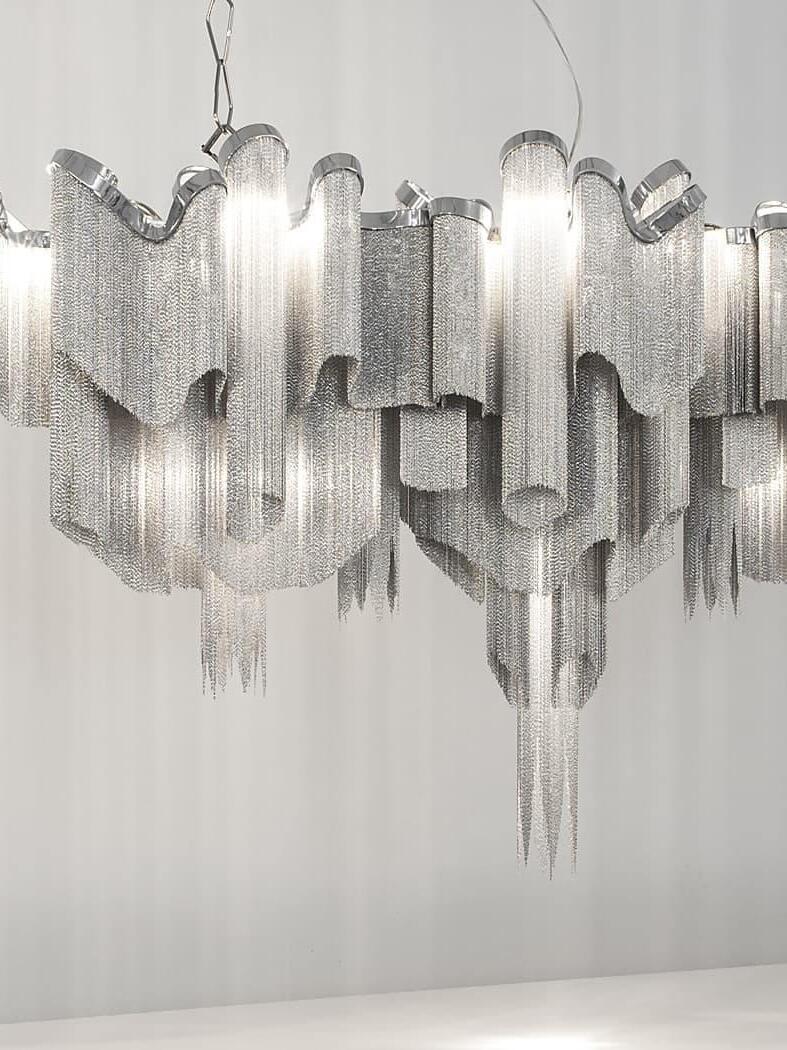 Elongated silver-coloured chain chandelier with two suspension points and cascading fringe
