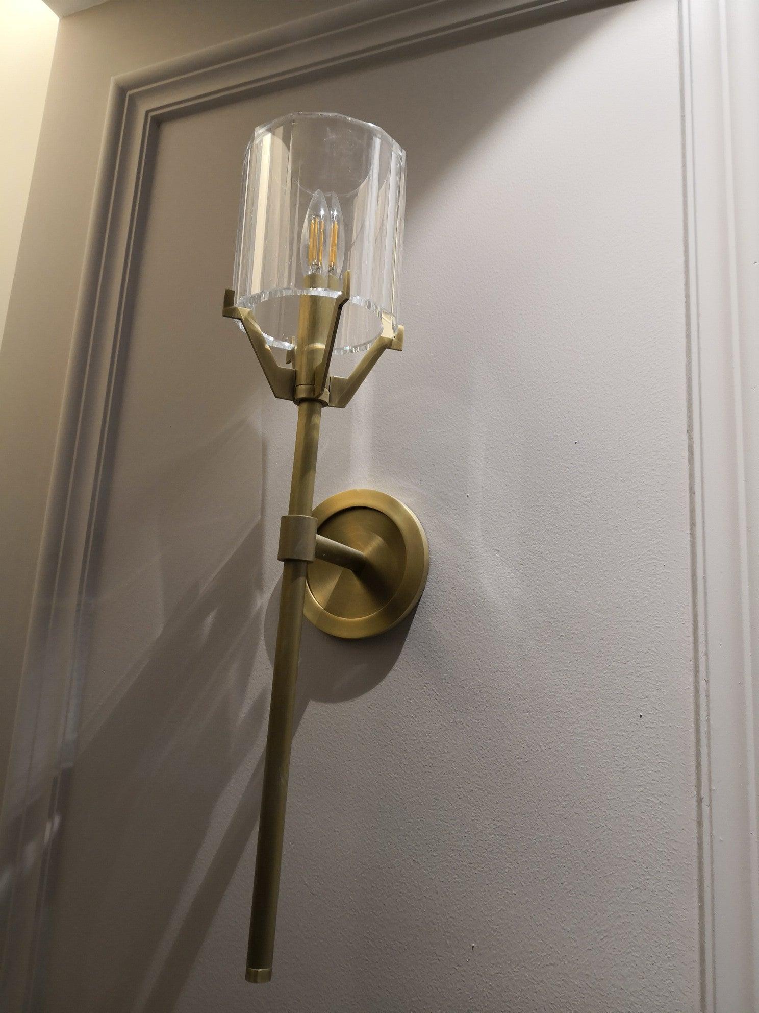 Gold Valdampierre light mounted on decorative paneling