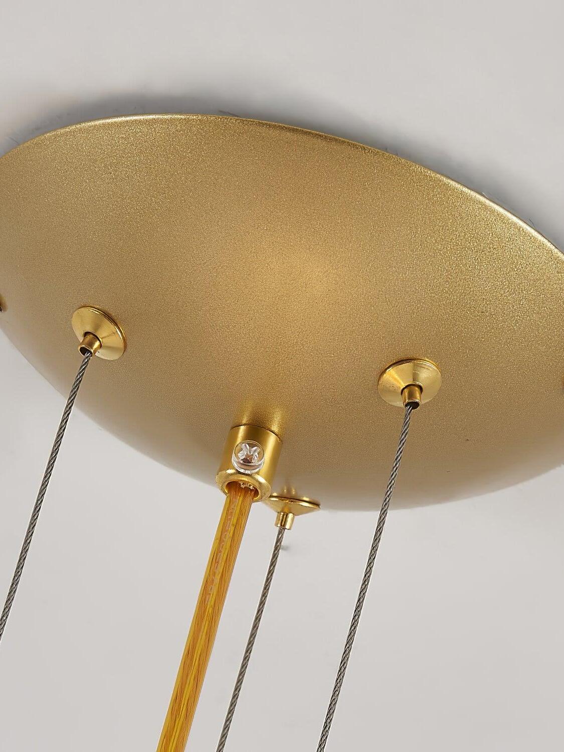 Round gold ceiling canopy and suspension cables