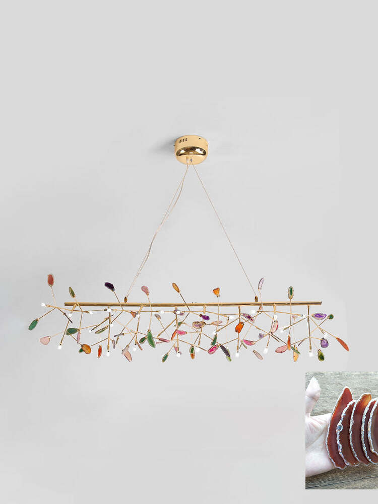 Long linear reference chandelier with warm stone inset