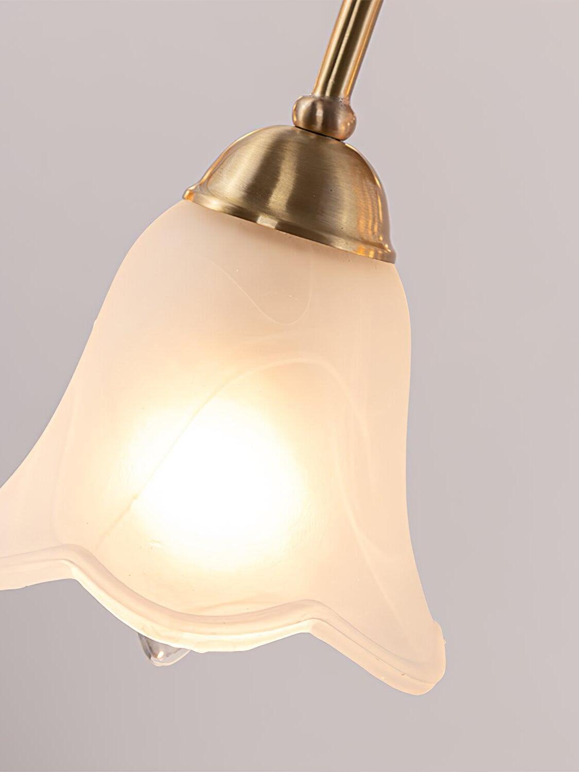 Close lit white flower-shaped glass shade