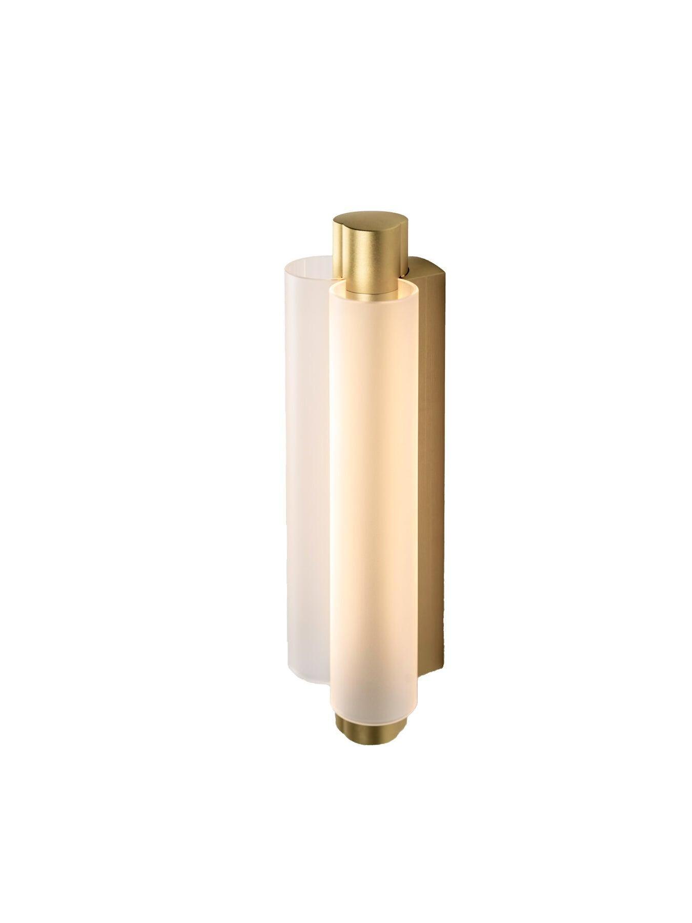 Isolated oblique gold-tone wall light with curved pale shade