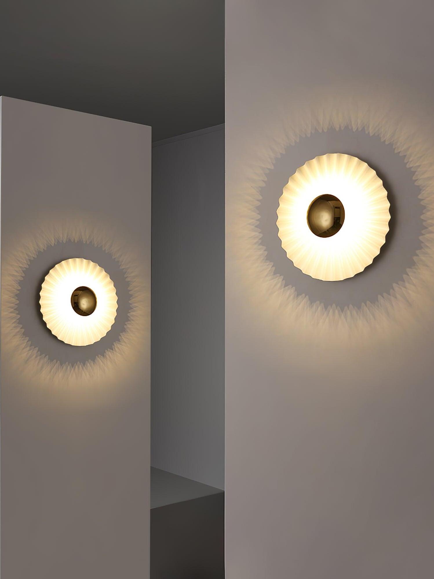 Two glowing radial wall lights on adjoining walls