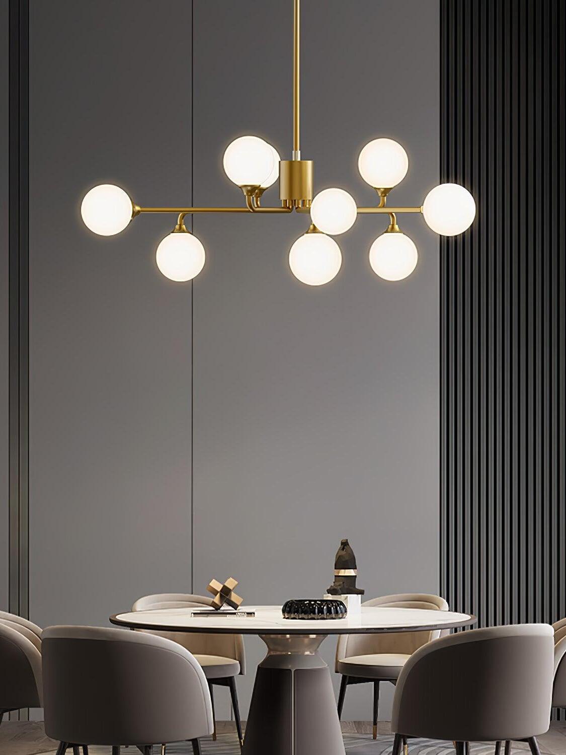 Six-globe chandelier above round dining table