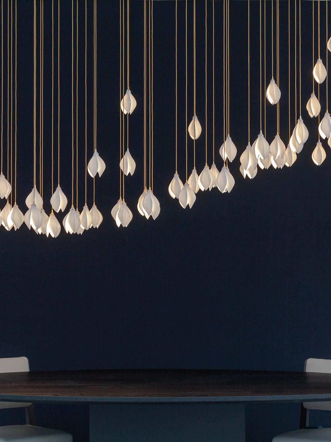 Long line of floral lights above a table