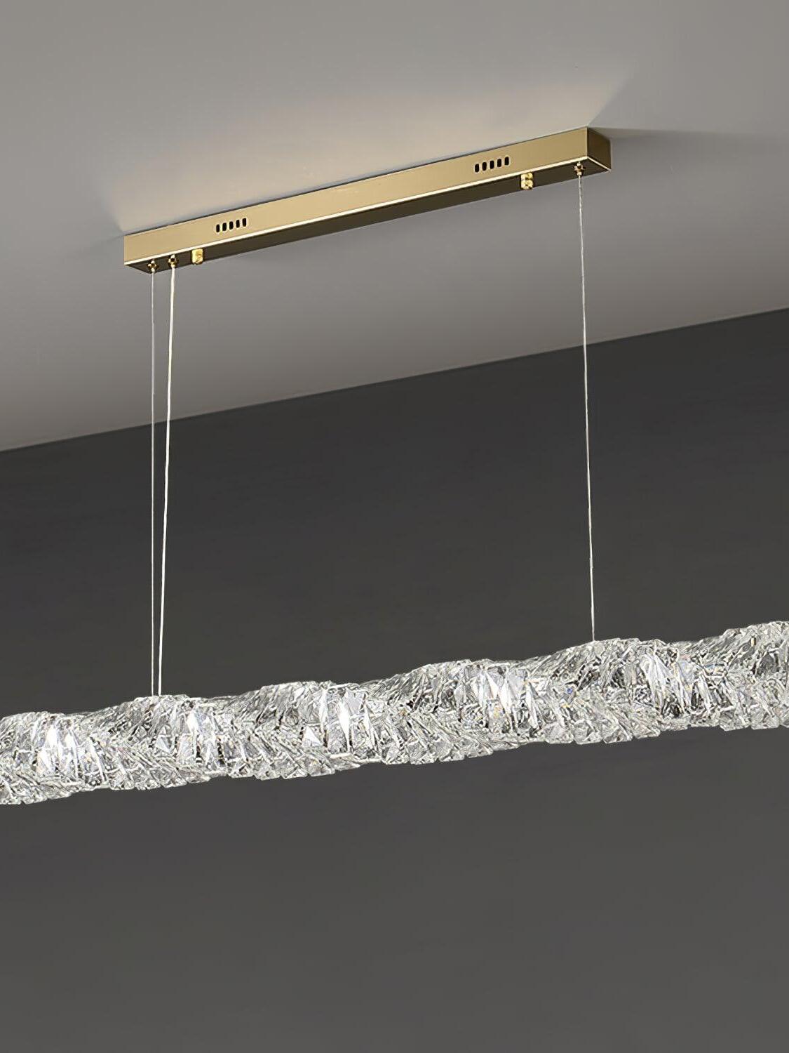Angled view of the gold canopy and crystal bar emitting cool-looking light