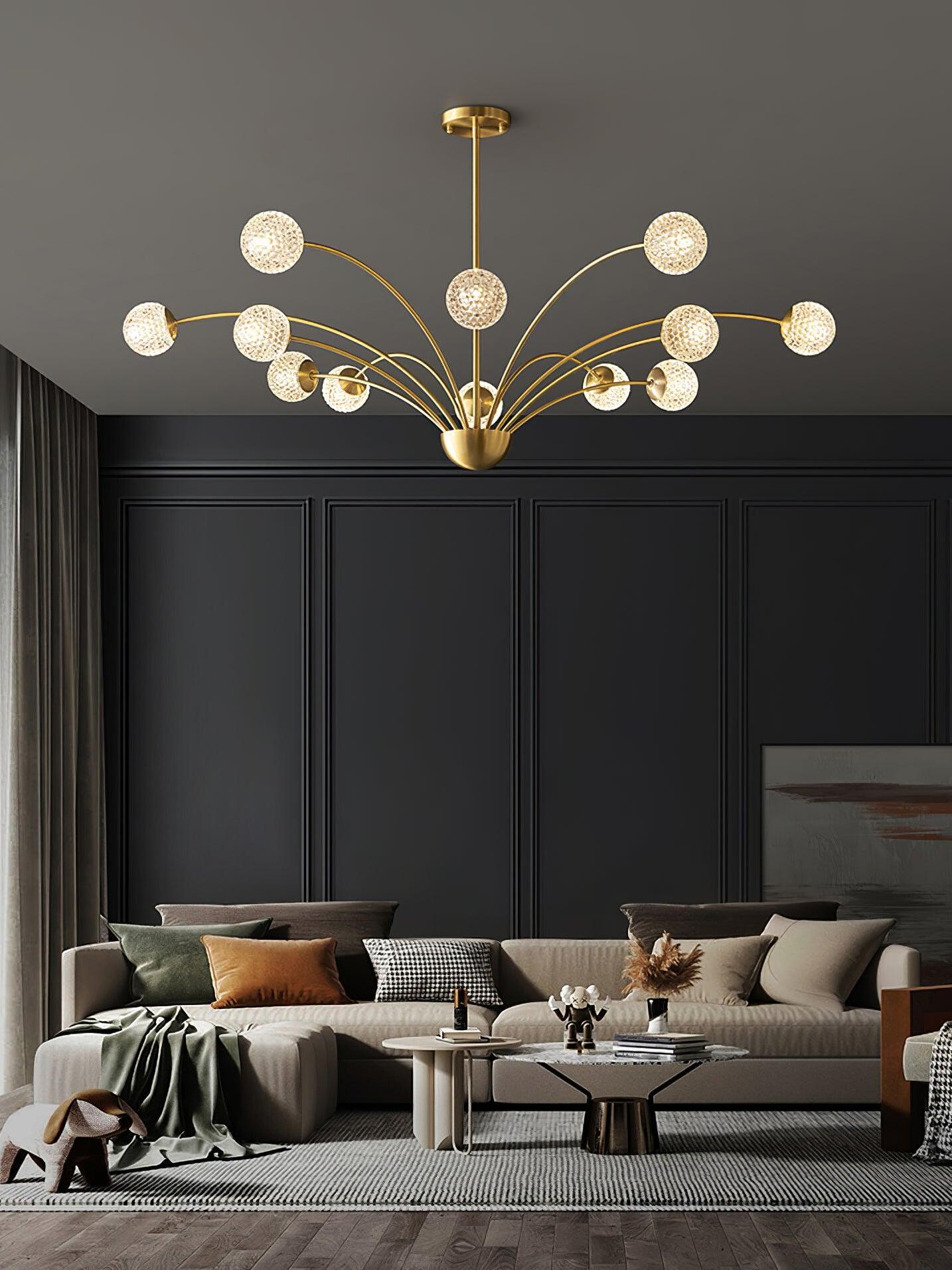 Broad textured globe chandelier with a central front globe above sofas and dark wall panels