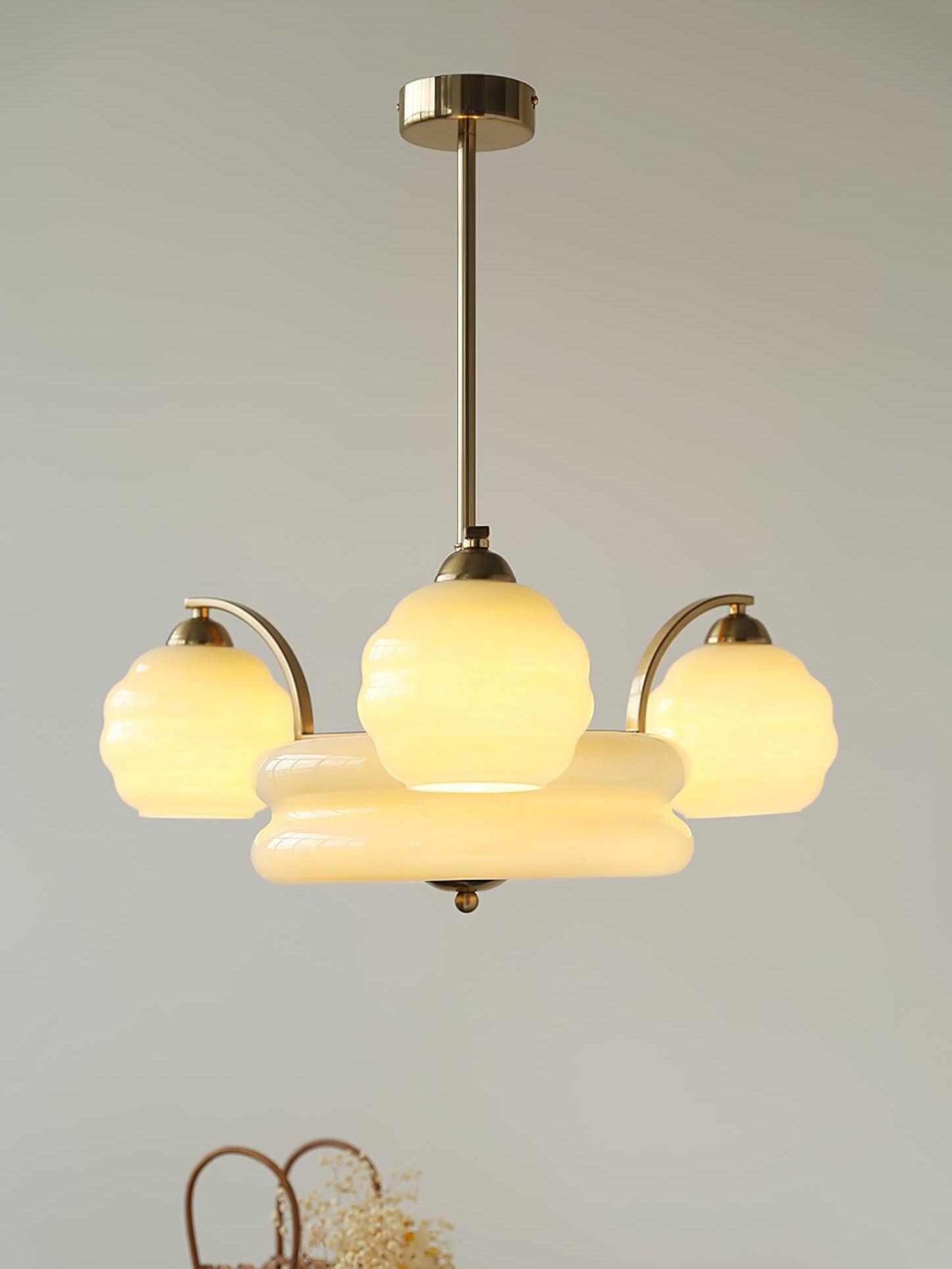 Gold finish glass chandelier with illuminated outer shades