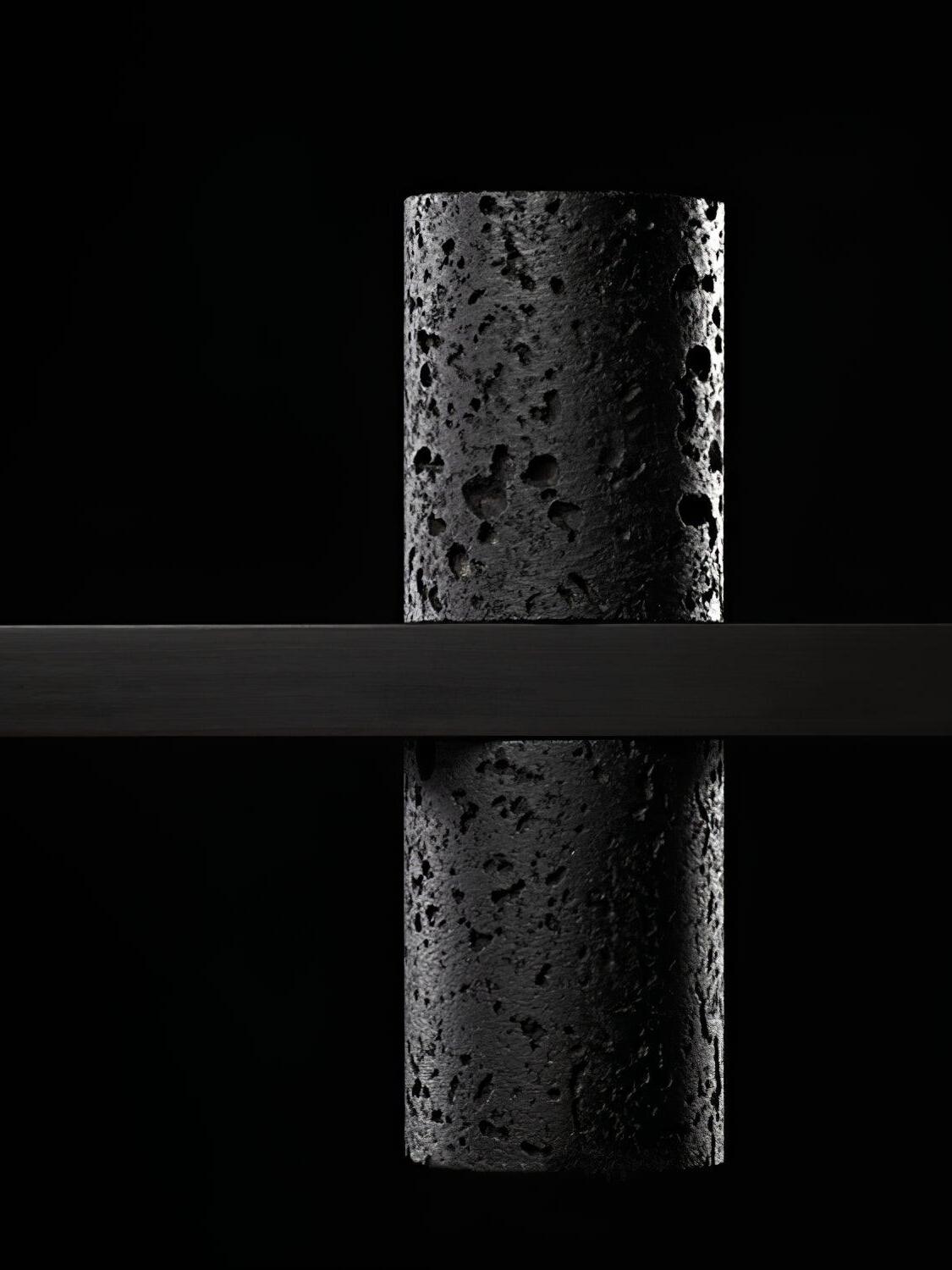 Black cylinder crossing the horizontal supporting bar