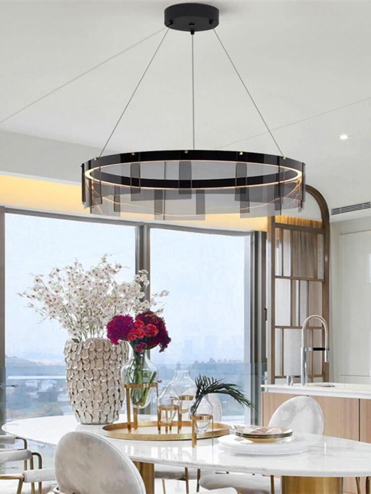 Stratos chandelier beside a window and dining table